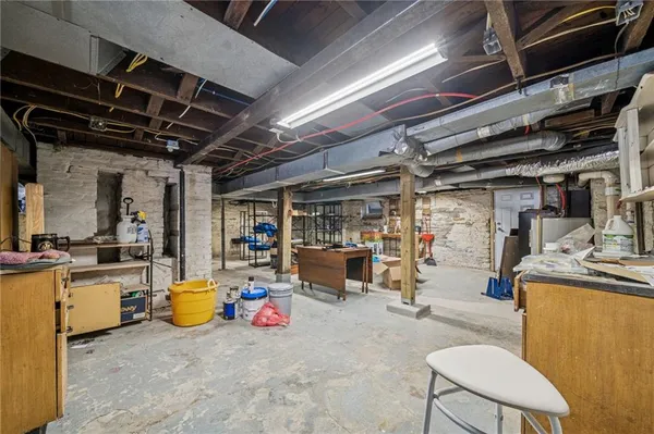 a view of a kitchen with a sink and cabinets