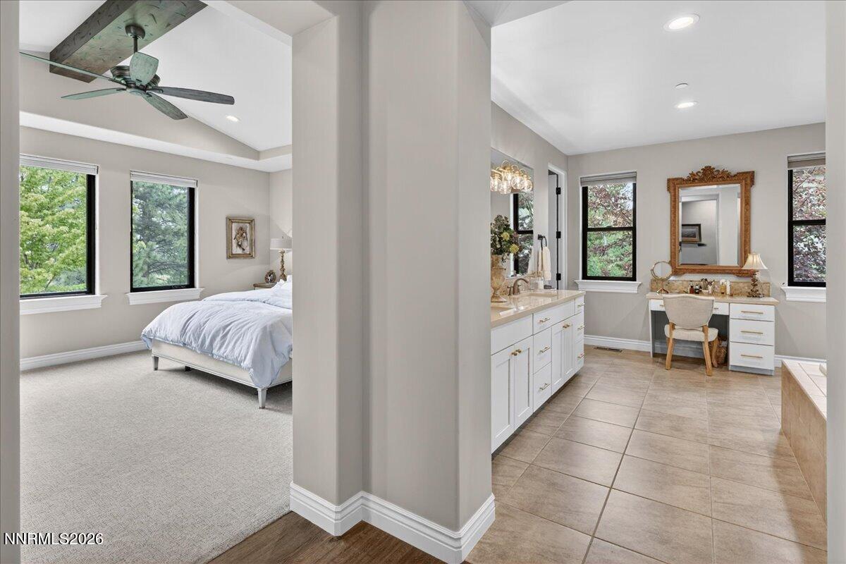 5096 Bordeaux Court Reno, NV 89511 - Photo 33 of 70 a spacious bedroom with a bed and a couch