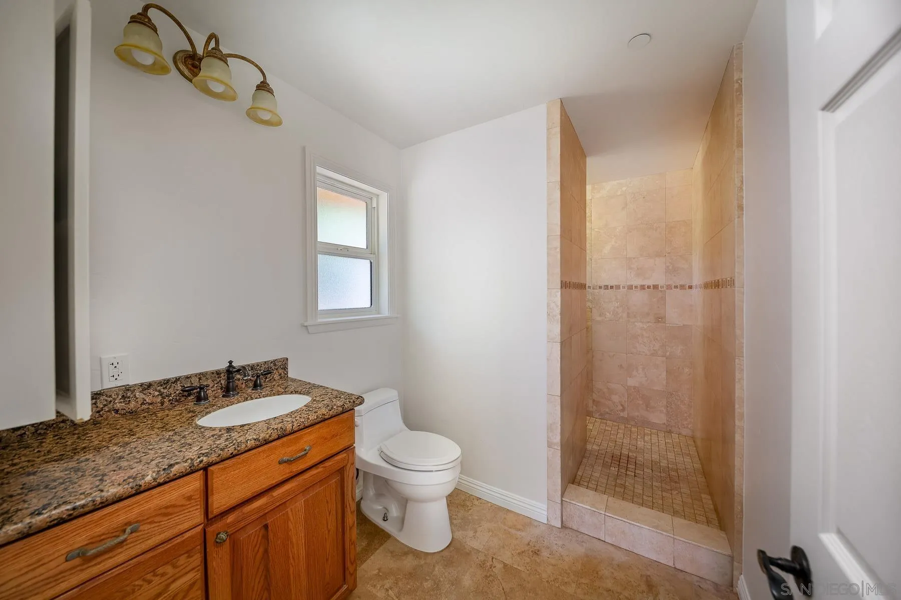 38960-62 Magee Road Pala, CA 92059 - Photo 15 of 25 a bathroom with a granite countertop sink toilet and shower
