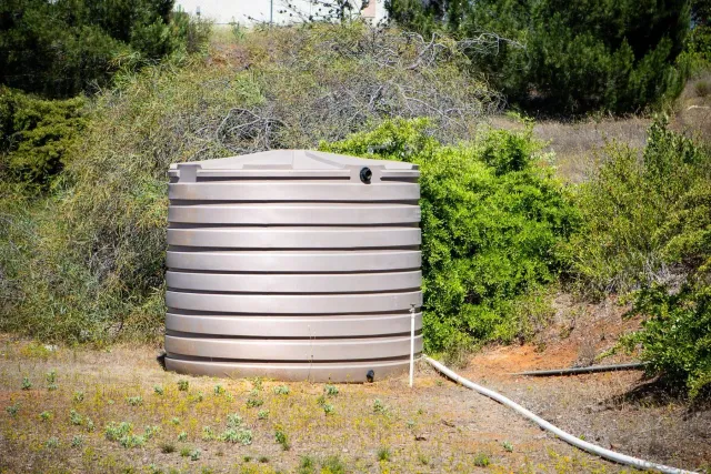 an aerial view of a house with a mountain