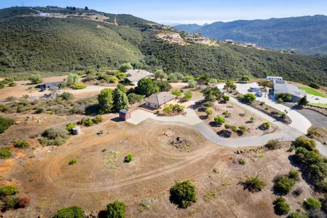 an aerial view of residential house and parking space