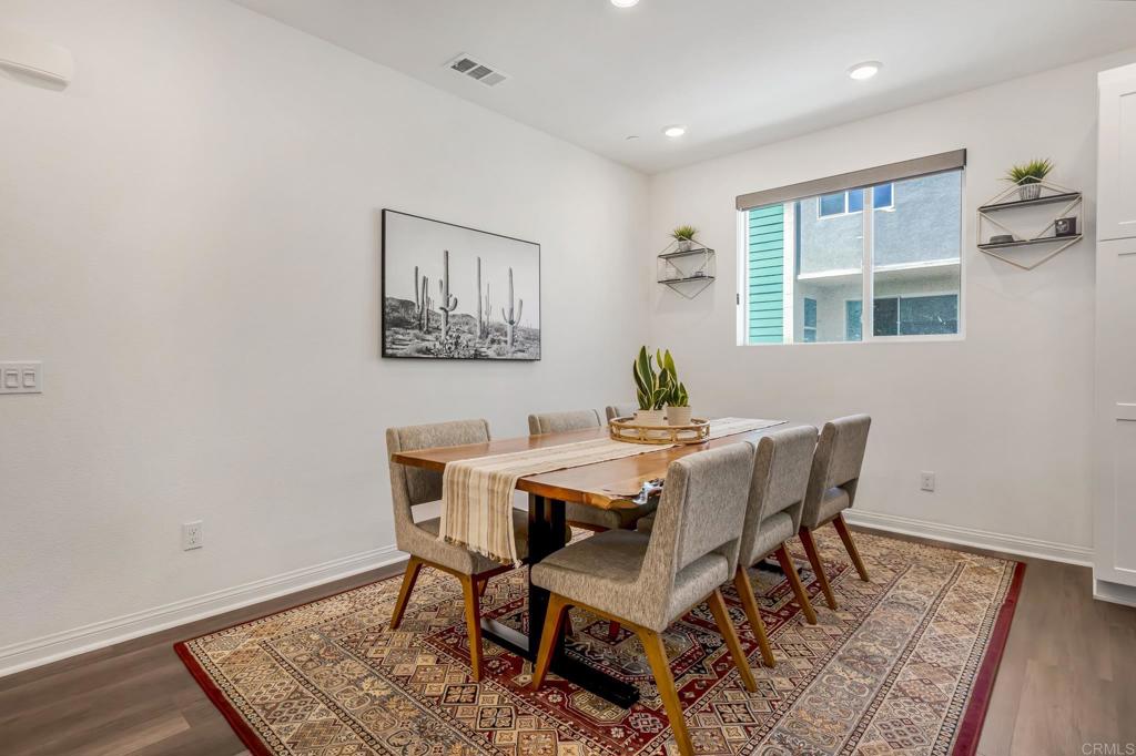 1978 Affinity Lane Chula Vista, CA 91915 - Photo 11 of 26 a view of a dining room with furniture and wooden floor