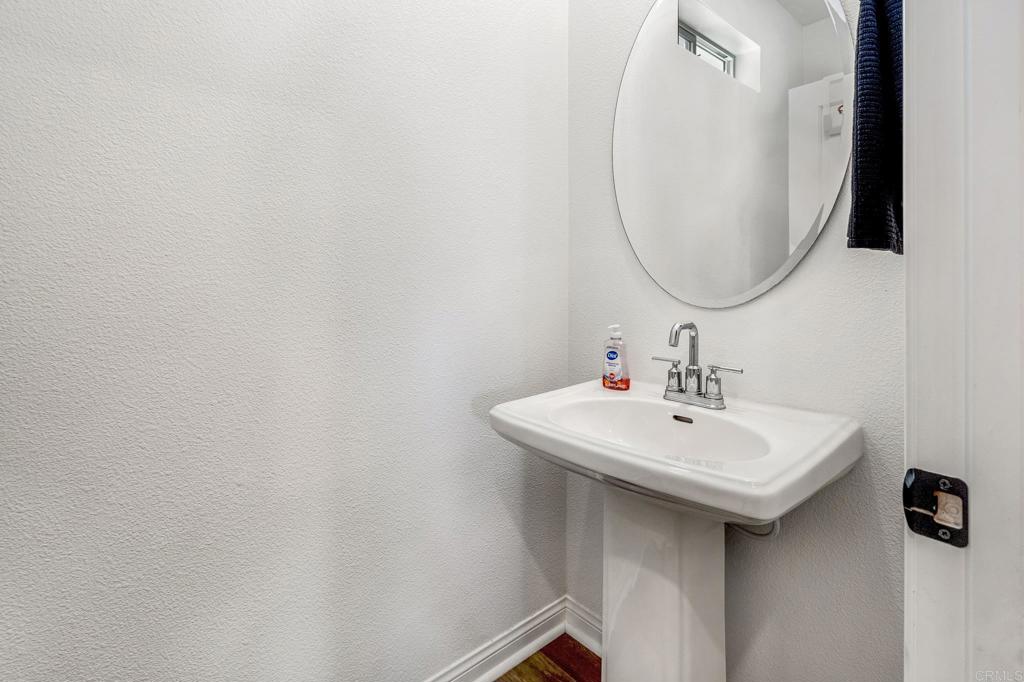 1978 Affinity Lane Chula Vista, CA 91915 - Photo 12 of 26 a bathroom with a sink and a mirror