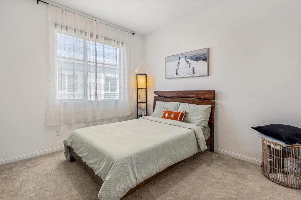 1978 Affinity Lane Chula Vista, CA 91915 - Photo 14 of 26 a bedroom with a bed and a window