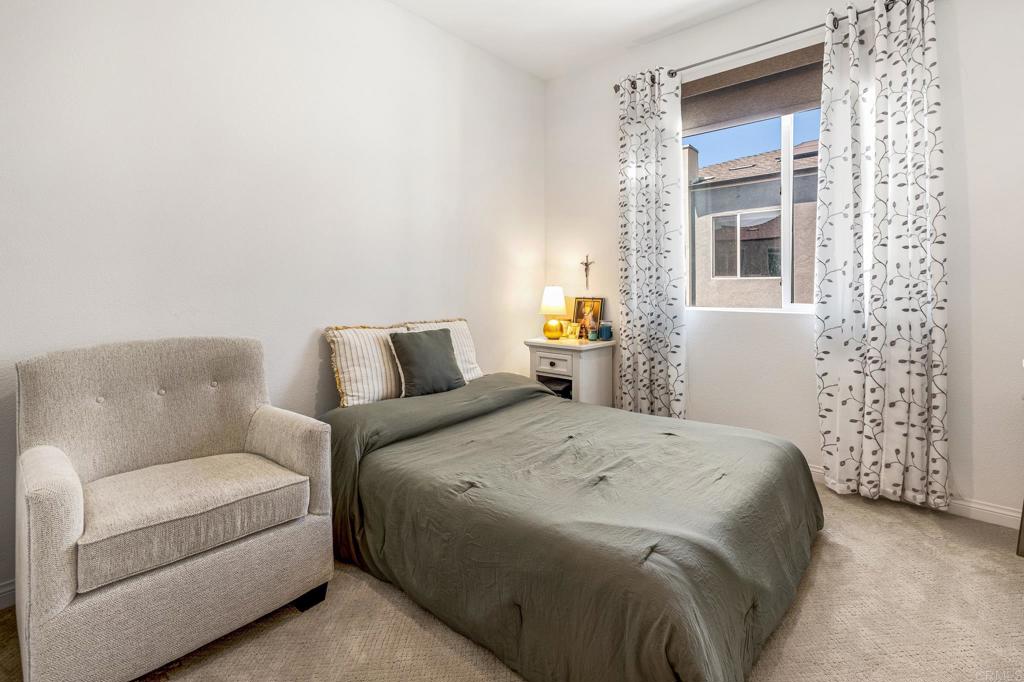 1978 Affinity Lane Chula Vista, CA 91915 - Photo 15 of 26 a bedroom with a bed and a couch