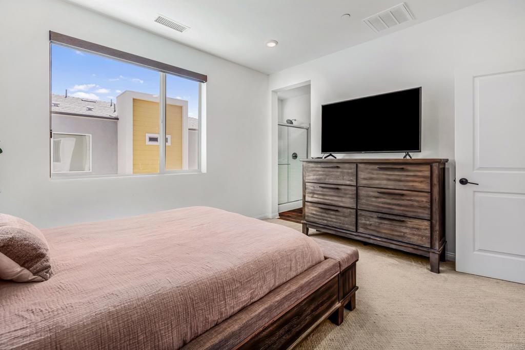 1978 Affinity Lane Chula Vista, CA 91915 - Photo 18 of 26 a bedroom with a bed and flat screen tv