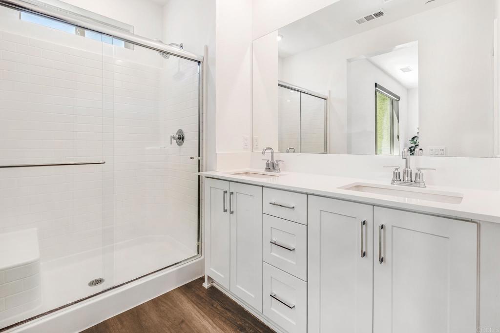 1978 Affinity Lane Chula Vista, CA 91915 - Photo 19 of 26 a bathroom with a double vanity sink and mirror