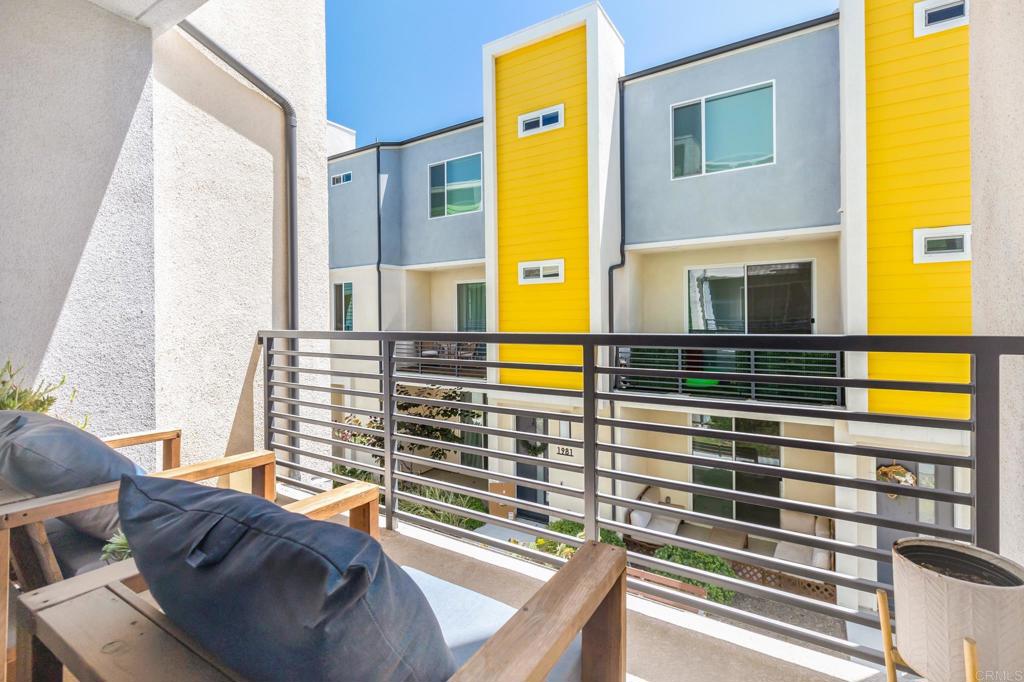 1978 Affinity Lane Chula Vista, CA 91915 - Photo 21 of 26 a view of balcony with wooden floor and outdoor seating