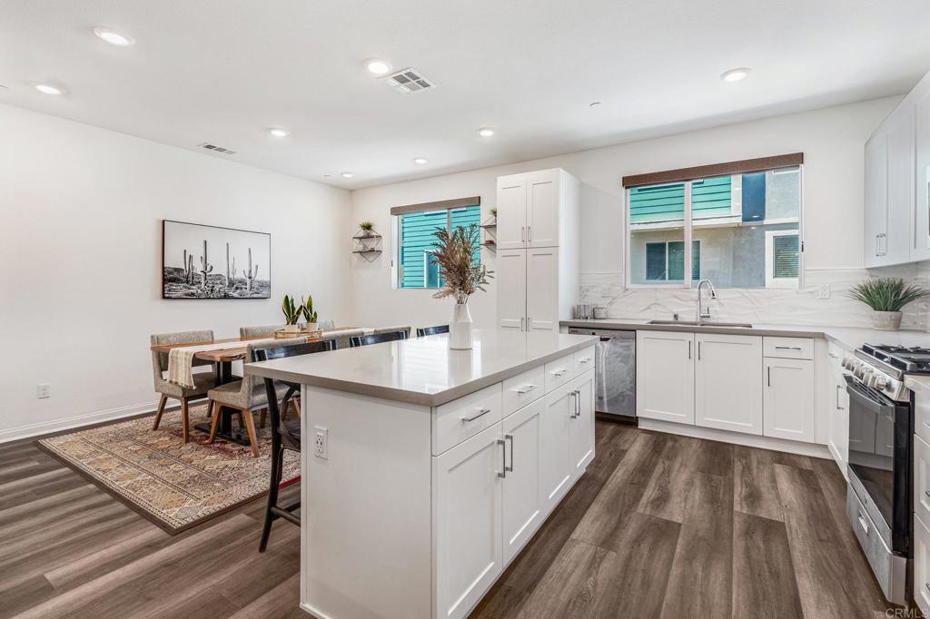 1978 Affinity Lane Chula Vista, CA 91915 - Photo 7 of 26 a kitchen with a sink stove and cabinets