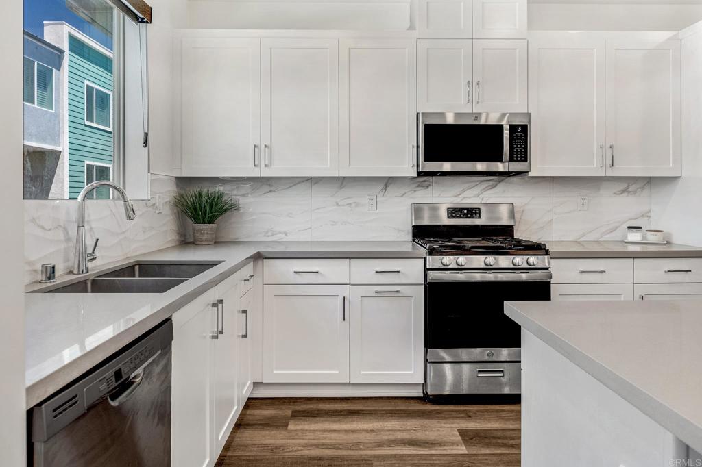 1978 Affinity Lane Chula Vista, CA 91915 - Photo 8 of 26 a kitchen with cabinets appliances and a sink