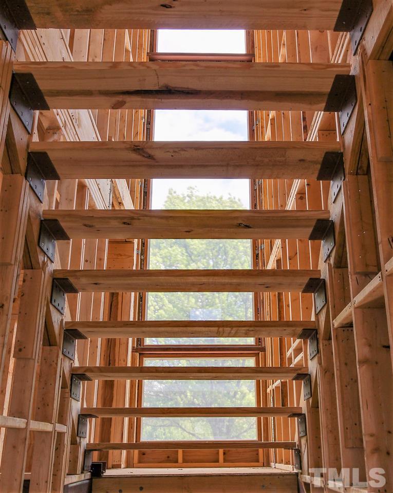 400 Chavis Way Raleigh, NC 27601 - Photo 11 of 25 Floating stairs as to not inhibit the natural light that flows through the home