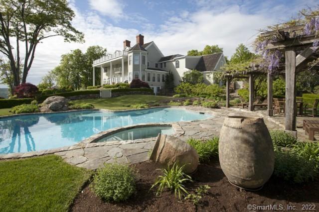 109 Mountain Road Kent, CT 06757 - Photo 1 of 1 a view of a house with pool plants and large trees
