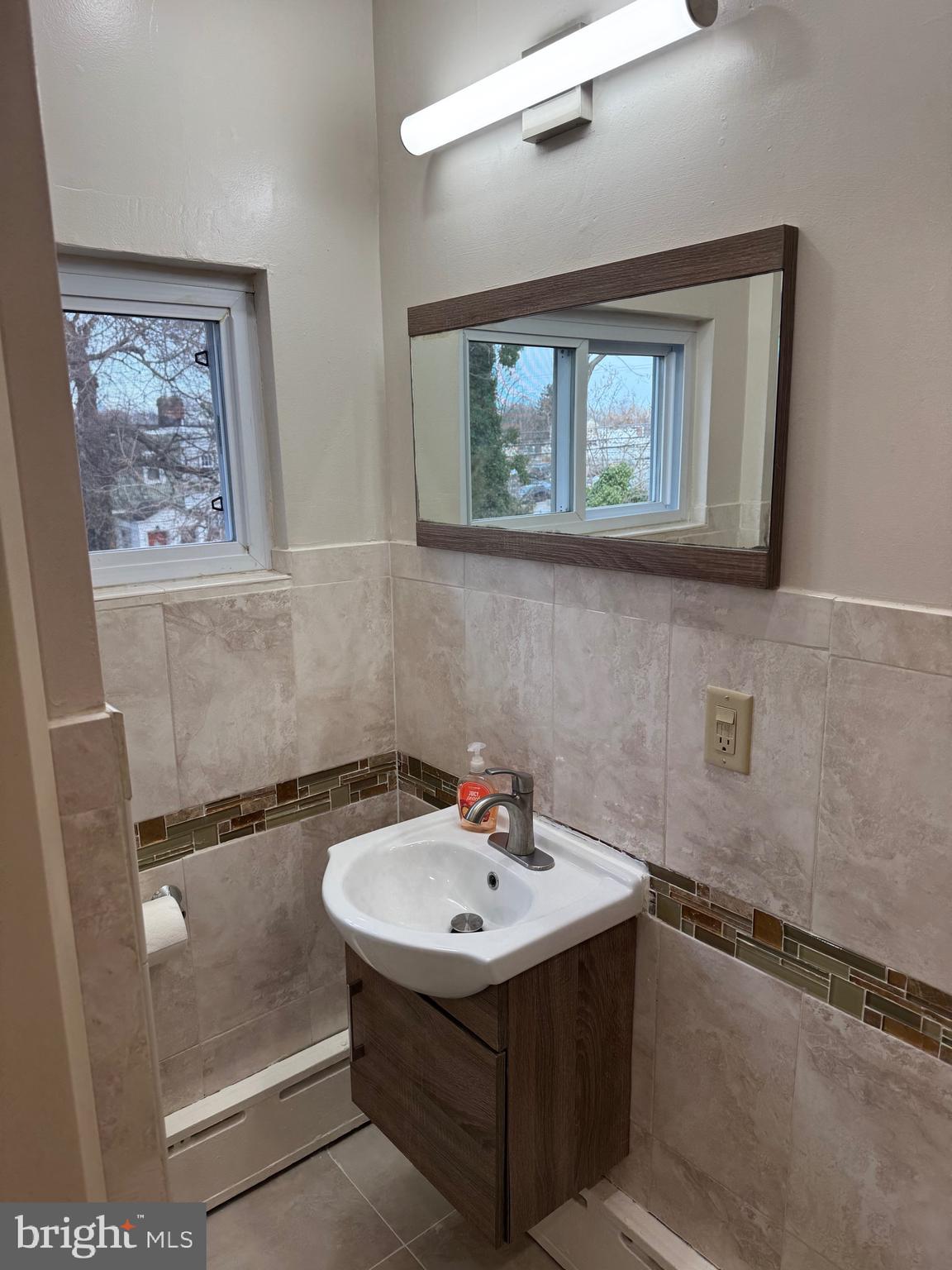 417 Laurel Road Lansdowne, PA 19050 - Photo 8 of 22 a bathroom with a sink and a mirror