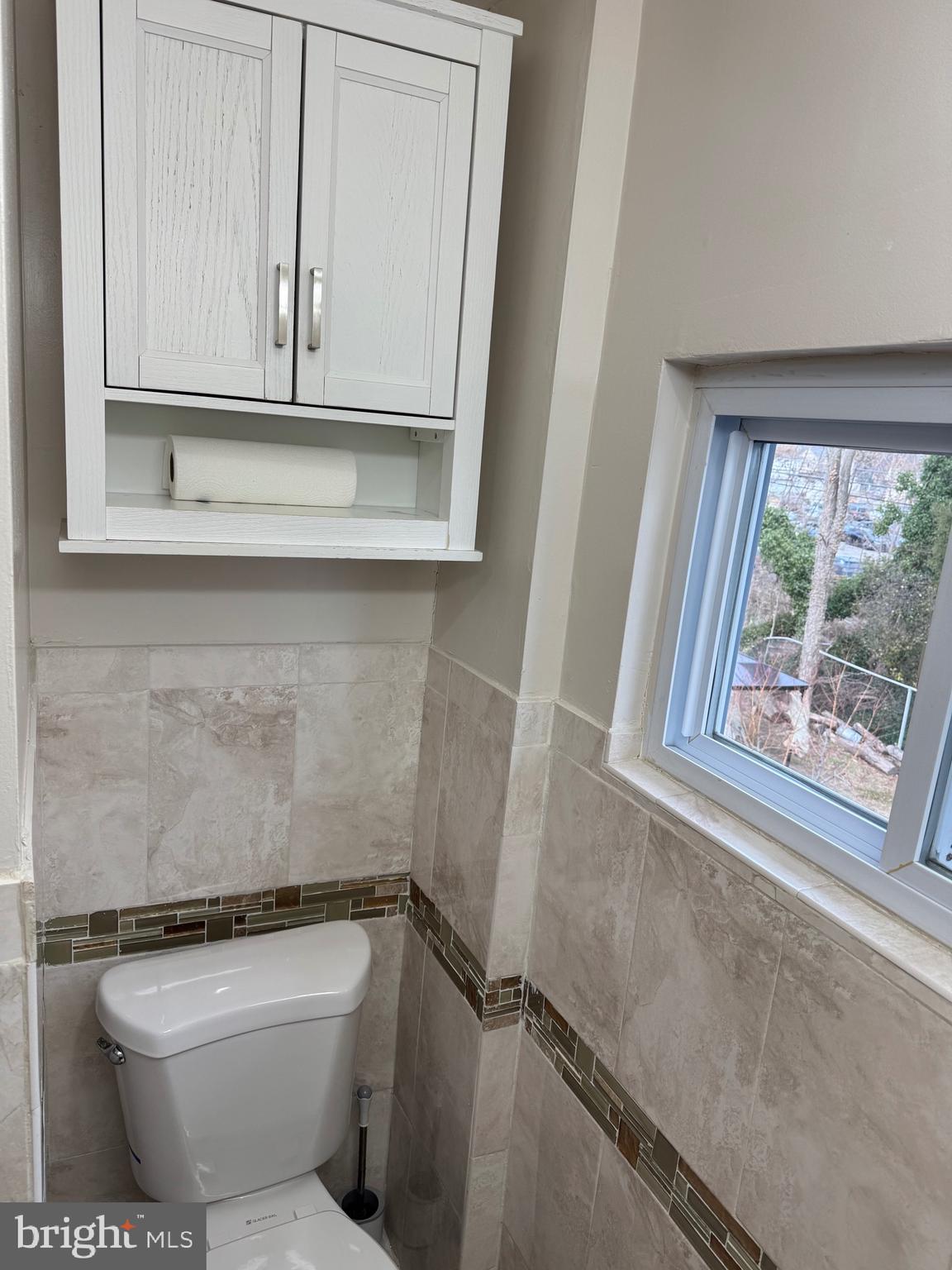 417 Laurel Road Lansdowne, PA 19050 - Photo 9 of 22 a bathroom with a toilet a sink and a window