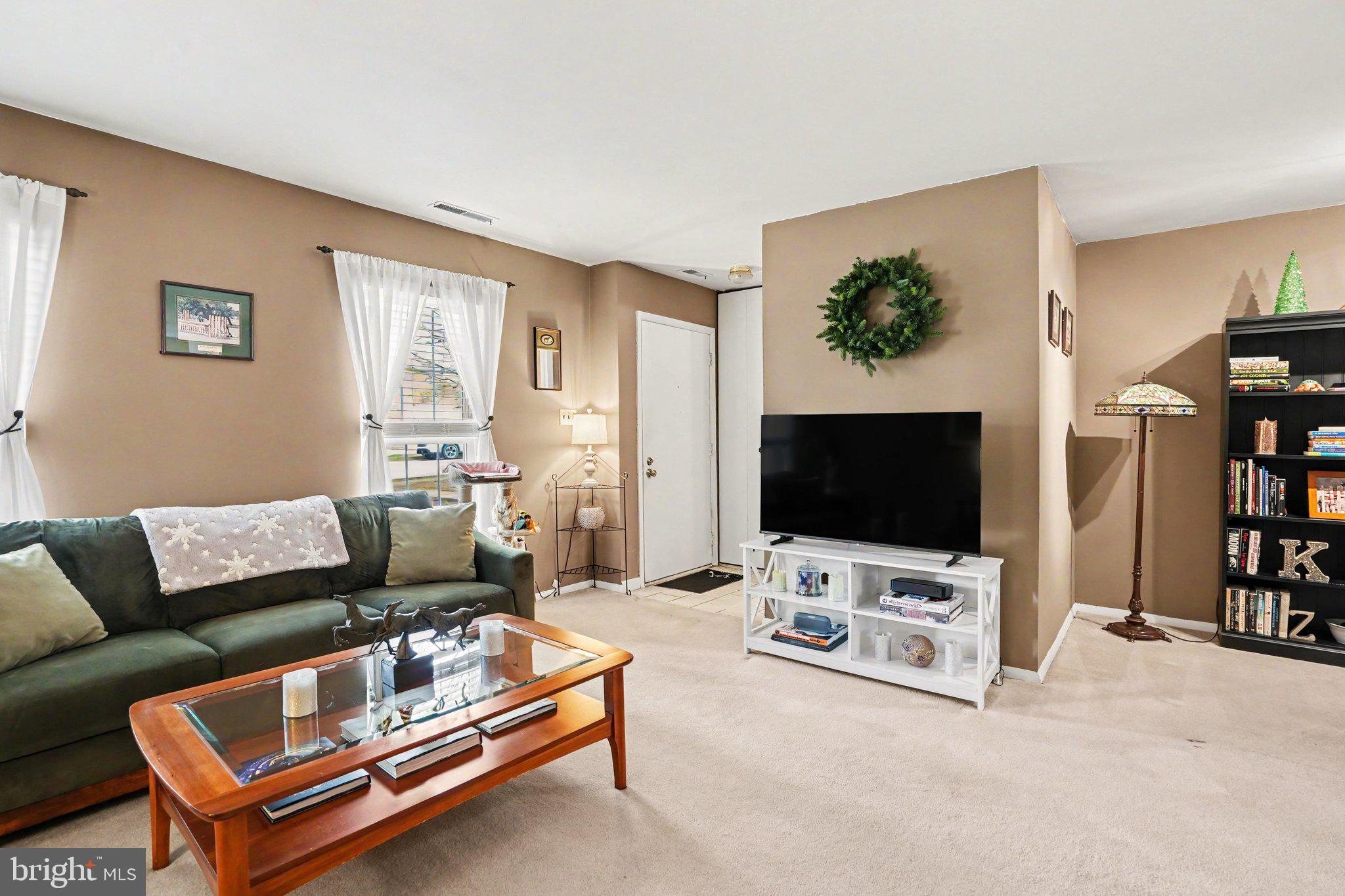 300 Lopax Road Harrisburg, PA 17112 - Photo 3 of 28 a living room with furniture and a flat screen tv