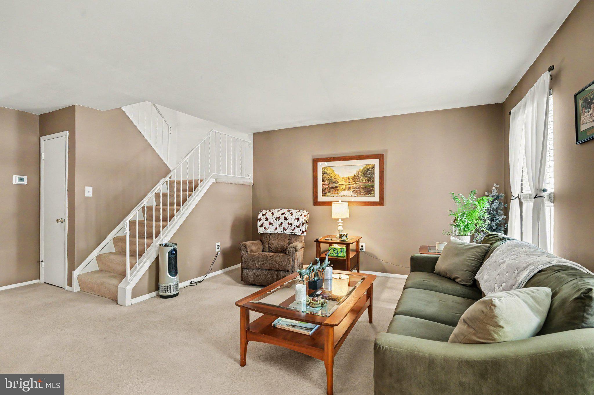 300 Lopax Road Harrisburg, PA 17112 - Photo 5 of 28 a living room with furniture and stairs