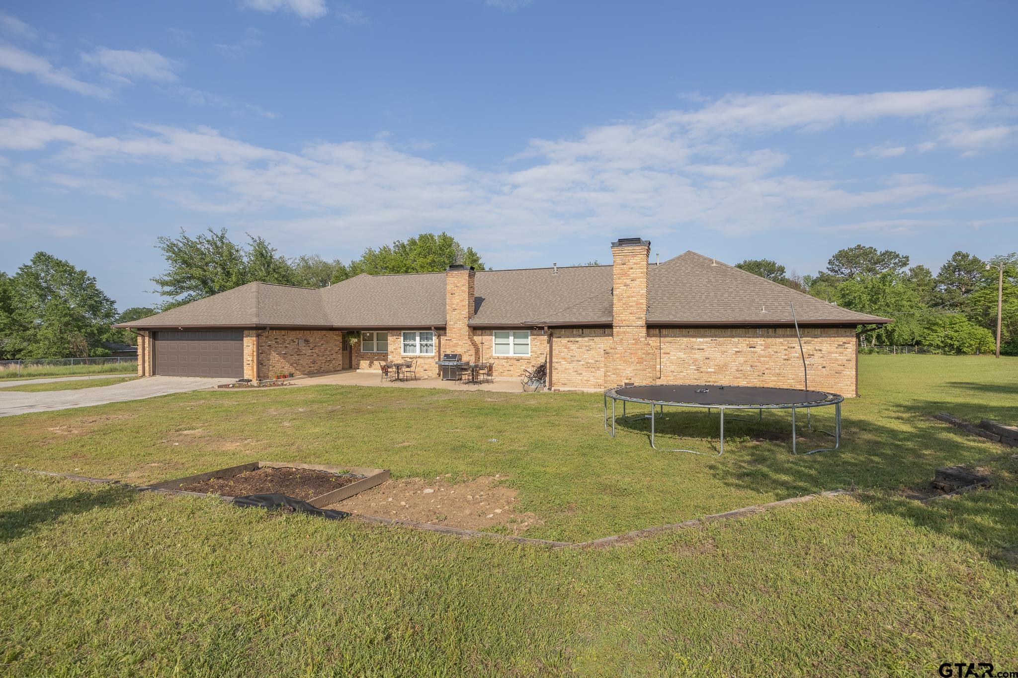 2201 Ridgley Tyler, TX 75703 - Photo 38 of 42 a view of a house with a yard and sitting area