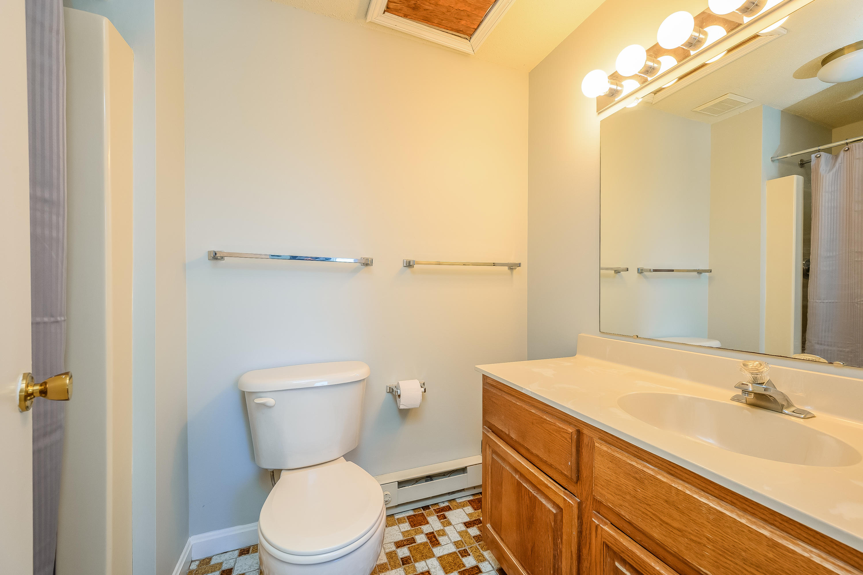174 Lowell Road, Unit D37 Mashpee, MA 02649 - Photo 16 of 19 a bathroom with a sink a toilet and shower