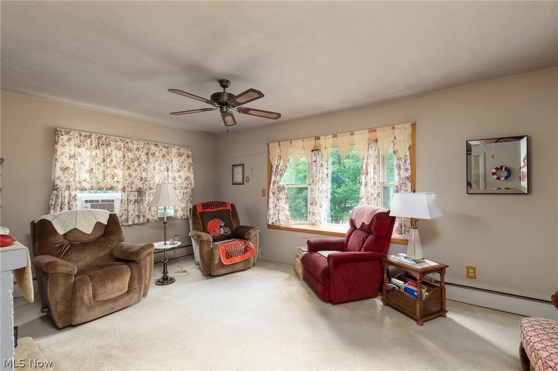 11634 Old State Road Chardon, OH 44024 - Photo 6 of 27 Living area featuring light carpet and a ceiling fan