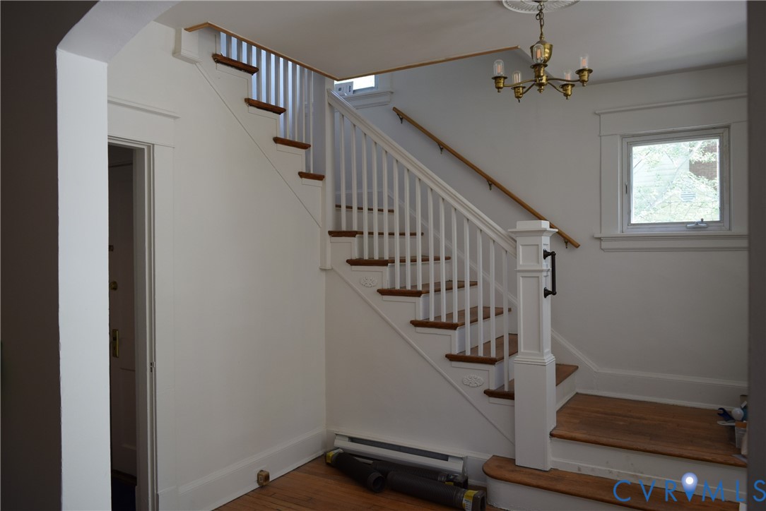 301 West 30th Street Richmond, VA 23225 - Photo 5 of 15 Staircase with wood finished floors, a baseboard h