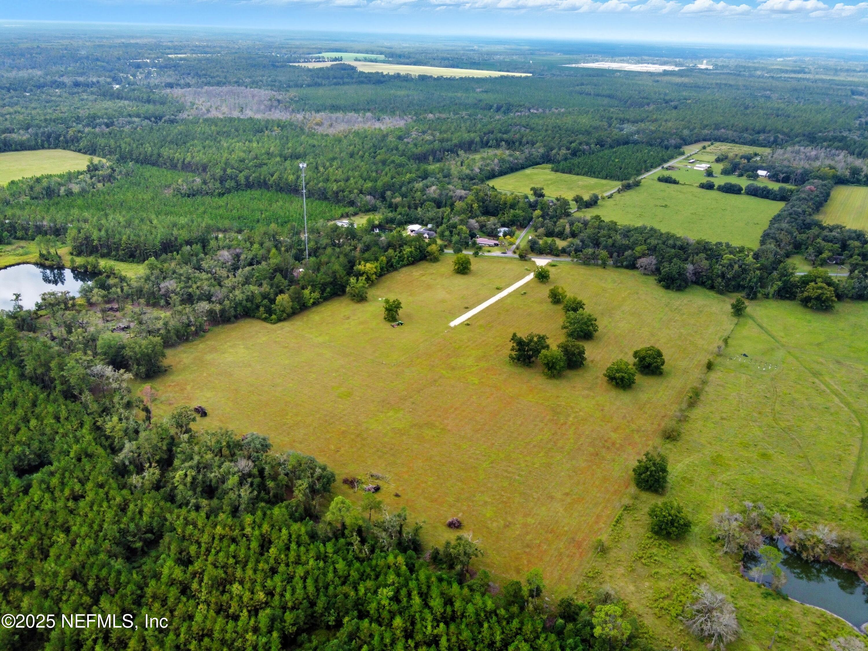 11242 Hogan Road Live Oak, FL 32060 - Photo 12 of 39 a view of a lake in middle of the town