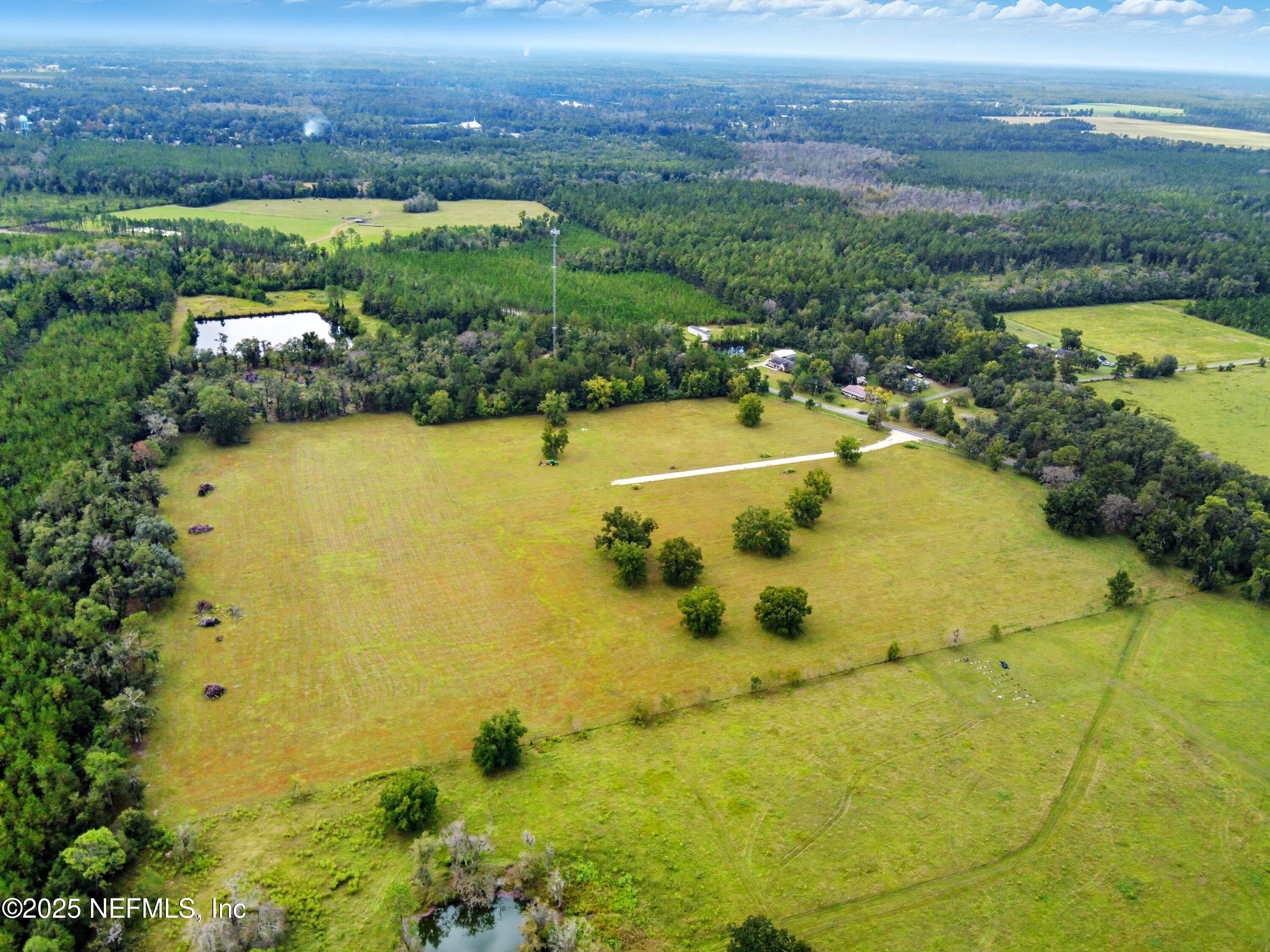 11242 Hogan Road Live Oak, FL 32060 - Photo 15 of 39 a view of a lake with a city view