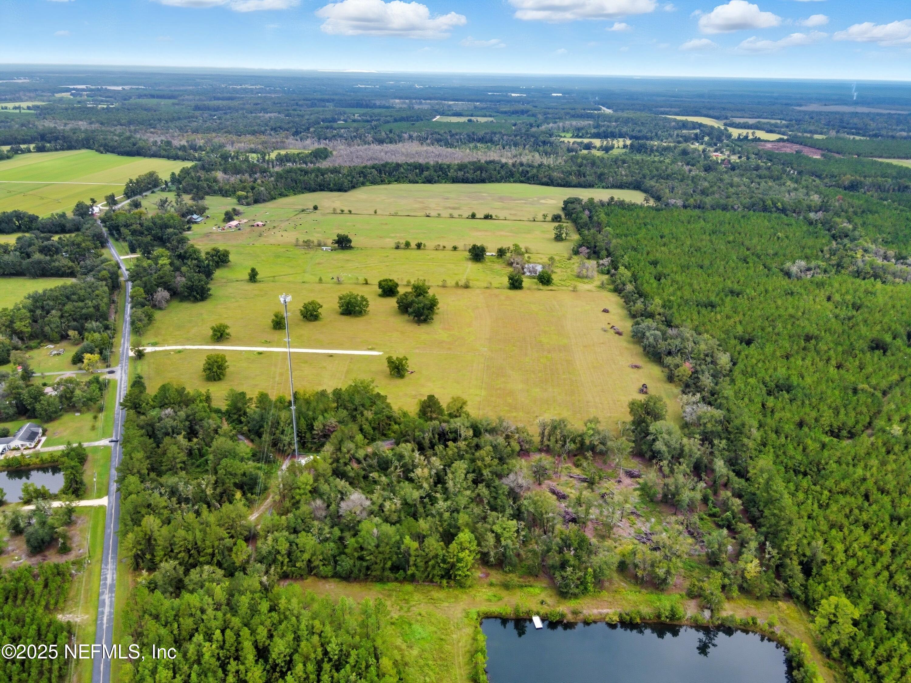 11242 Hogan Road Live Oak, FL 32060 - Photo 2 of 39 a view of a city with a lake