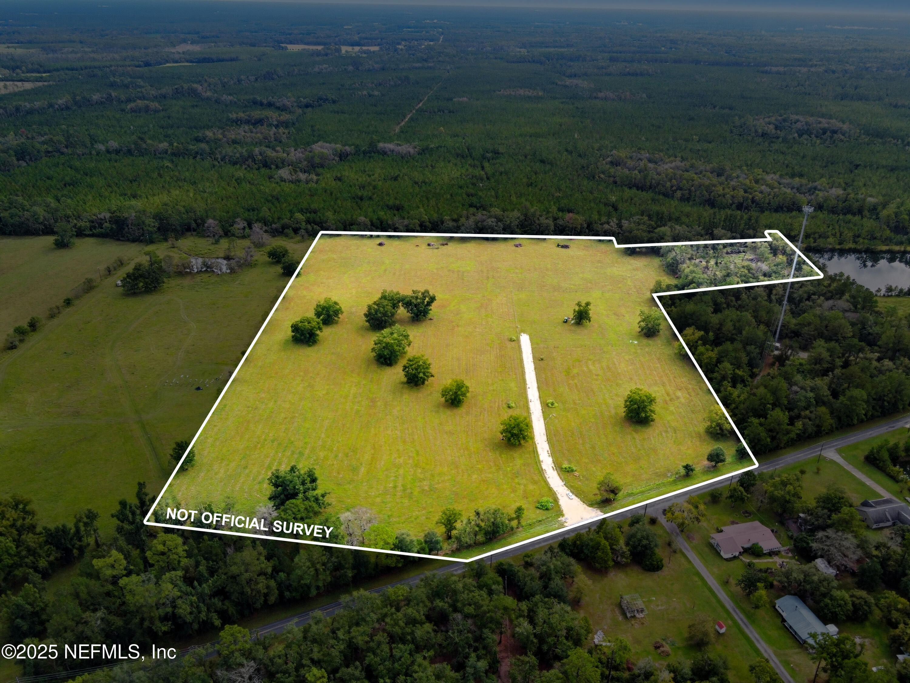 11242 Hogan Road Live Oak, FL 32060 - Photo 25 of 39 an aerial view of a house with a swimming pool