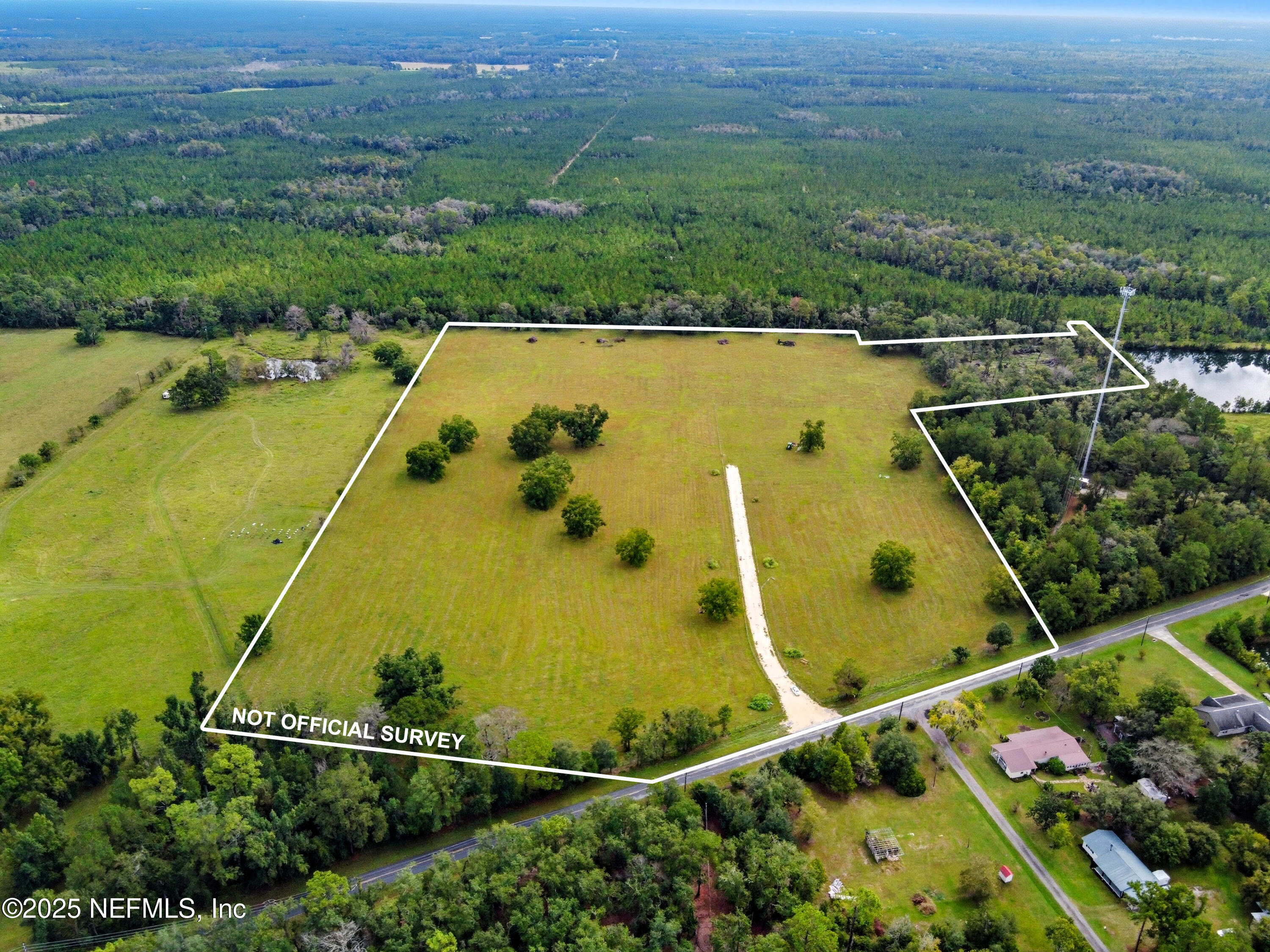 11242 Hogan Road Live Oak, FL 32060 - Photo 26 of 39 an aerial view of a residential houses with outdoor space and river
