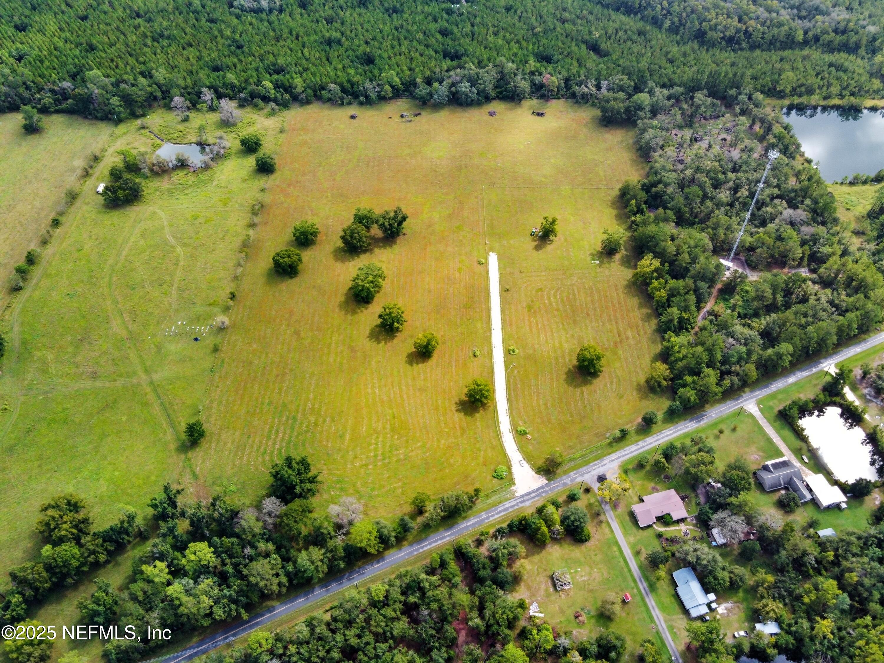 11242 Hogan Road Live Oak, FL 32060 - Photo 27 of 39 a view of a swimming pool and an outdoor space