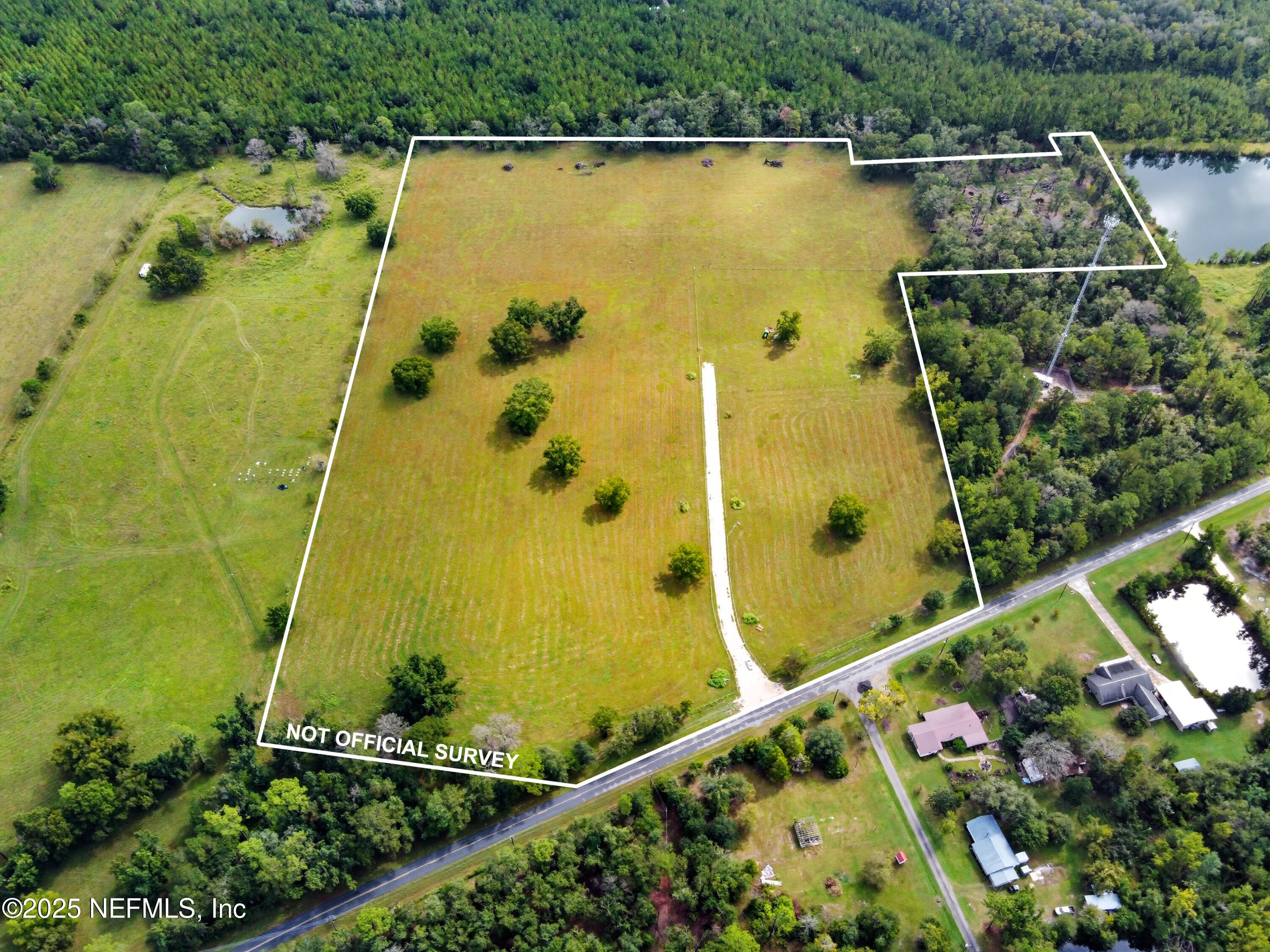 11242 Hogan Road Live Oak, FL 32060 - Photo 29 of 39 an aerial view of a residential houses with outdoor space and a lake view