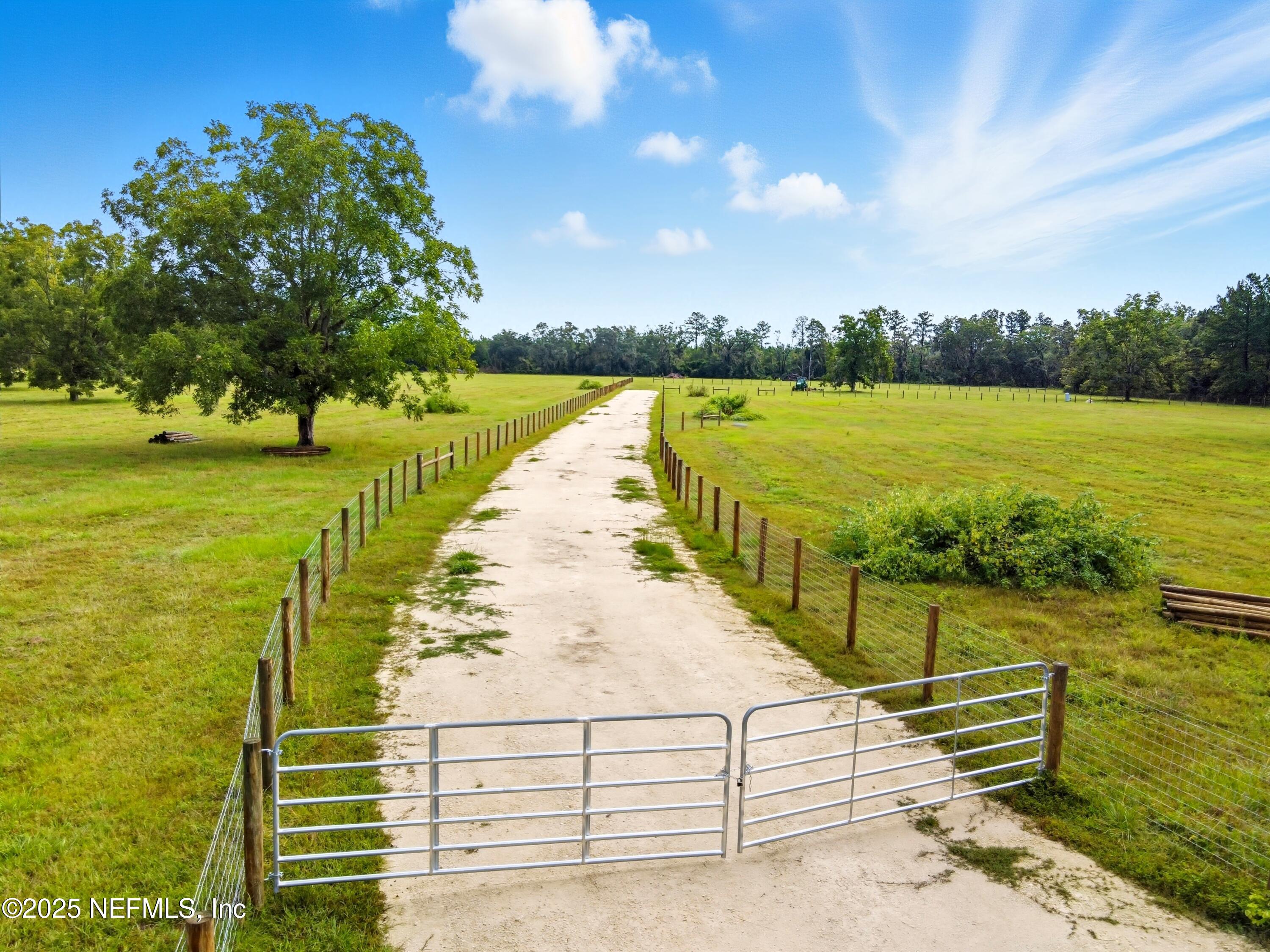 11242 Hogan Road Live Oak, FL 32060 - Photo 38 of 39 a view of a lake with a outdoor space