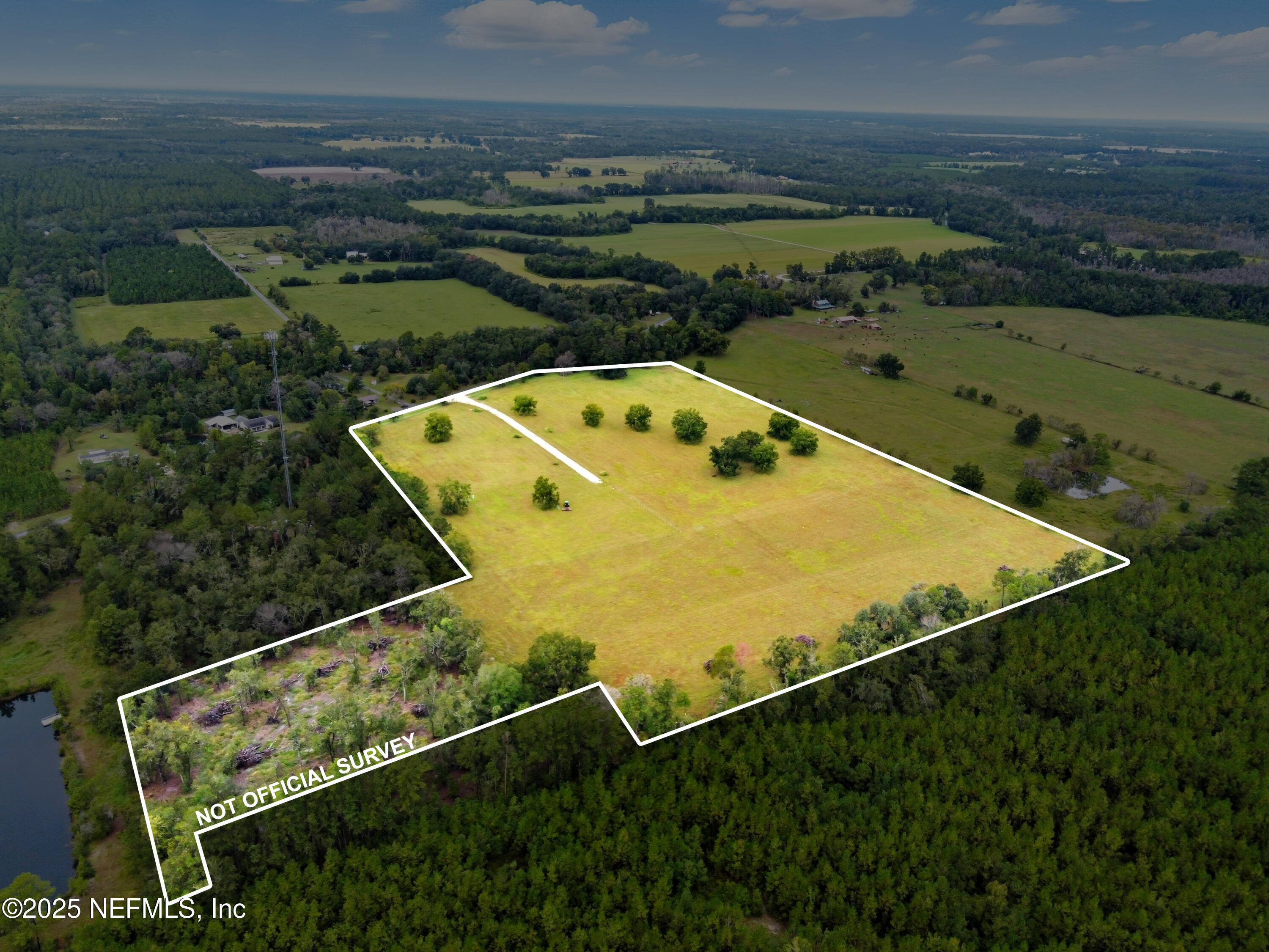 11242 Hogan Road Live Oak, FL 32060 - Photo 10 of 39 an aerial view of a pool