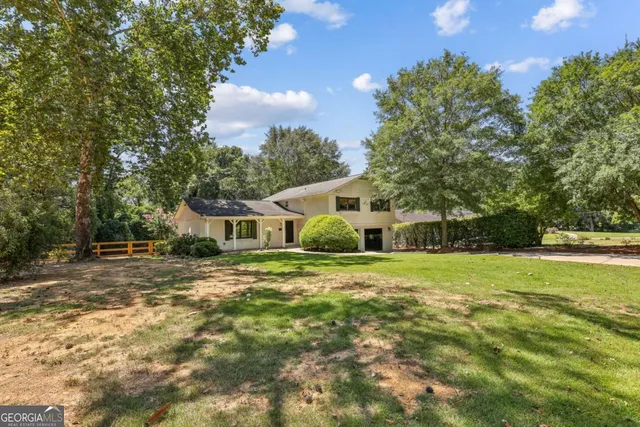 a view of a big yard next to a house