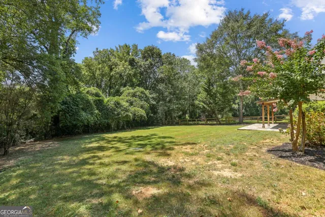 a view of a trees with a yard