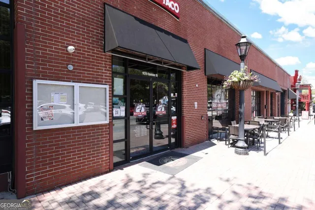 a view of a chairs and table in a patio