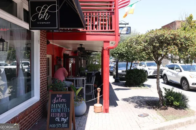 a view of street with sitting area