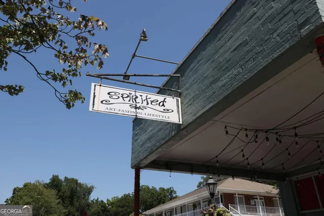 a view of a cafe with sitting area