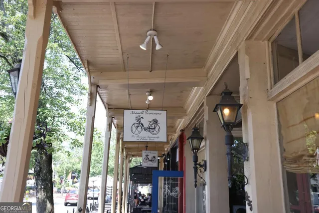 a view of a patio with table and chairs and potted plants