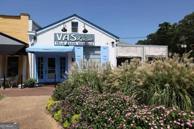 a swimming pool with outdoor seating yard and green space