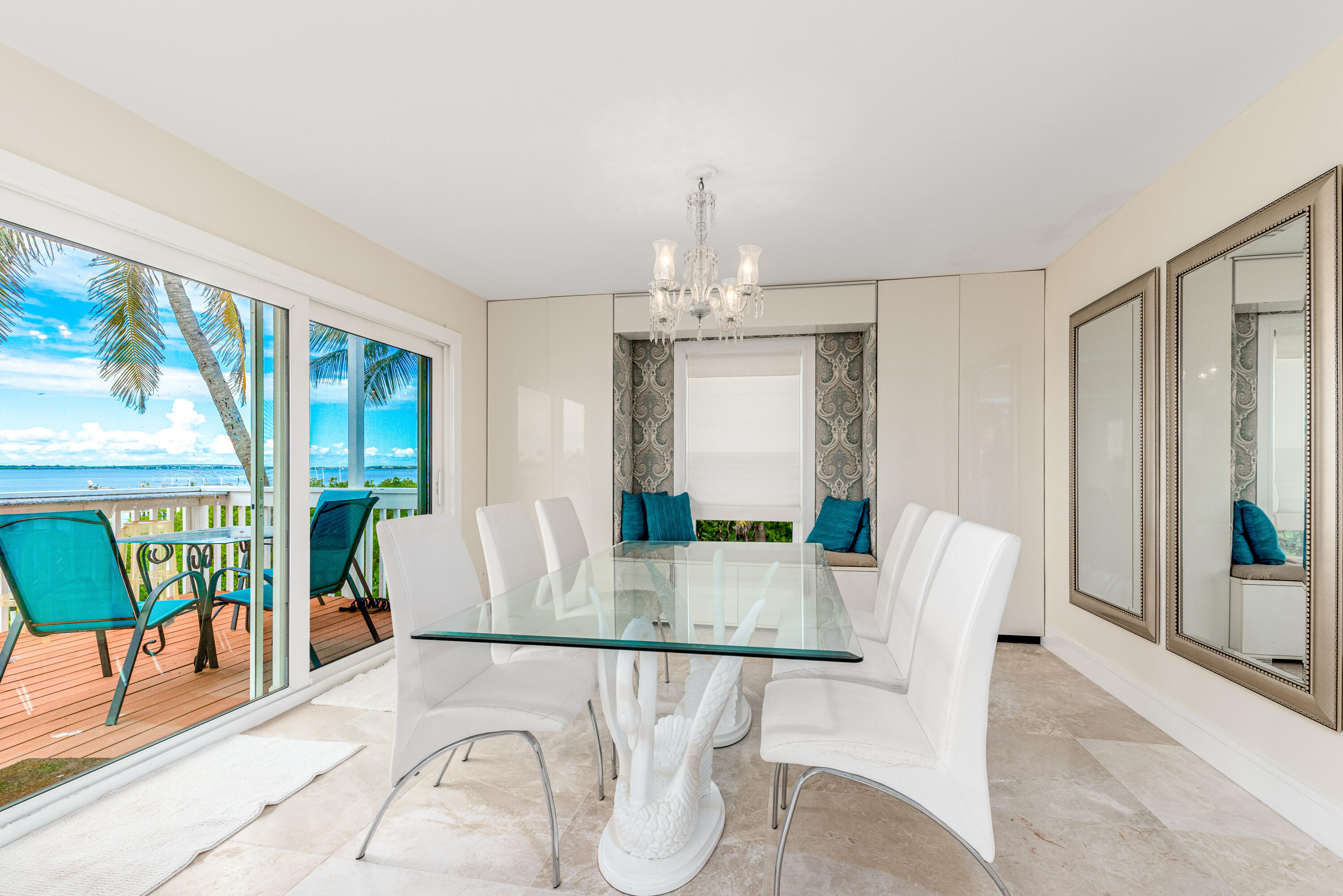 1470 Southeast MacArthur Boulevard Stuart, FL 34996 - Photo 8 of 15 a view of a dining room with furniture window and wooden floor