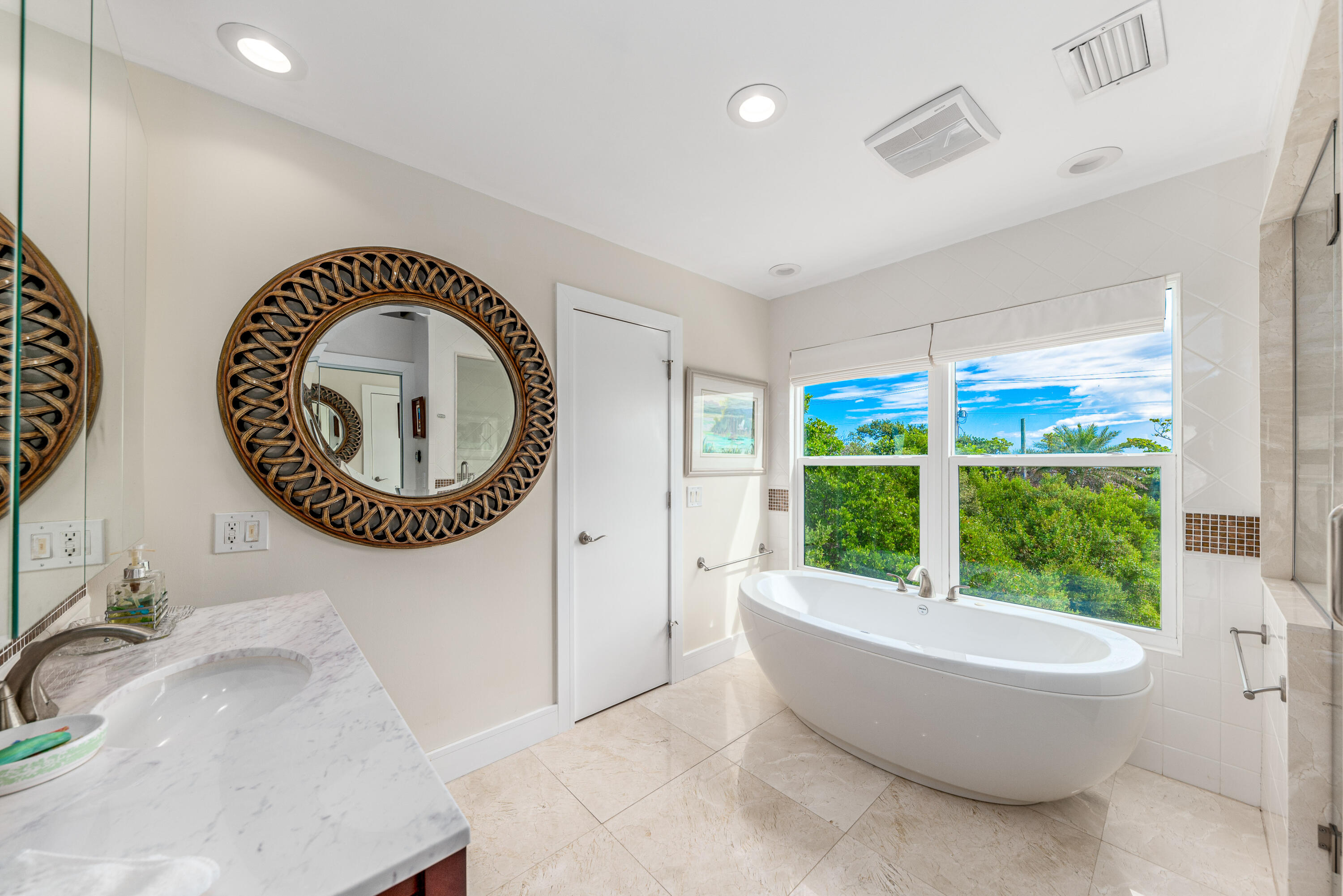 1470 Southeast MacArthur Boulevard Stuart, FL 34996 - Photo 10 of 15 a living room with a large window and a large window