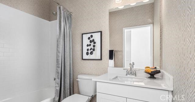 42409 Lamporo Way Indio, CA 92203 - Photo 11 of 24 a bathroom with a sink toilet and mirror