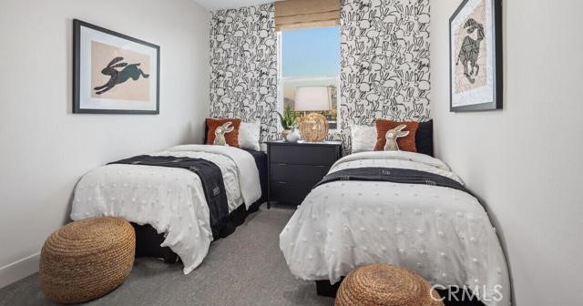 42409 Lamporo Way Indio, CA 92203 - Photo 12 of 24 a spacious bedroom with bed and a painting on the wall