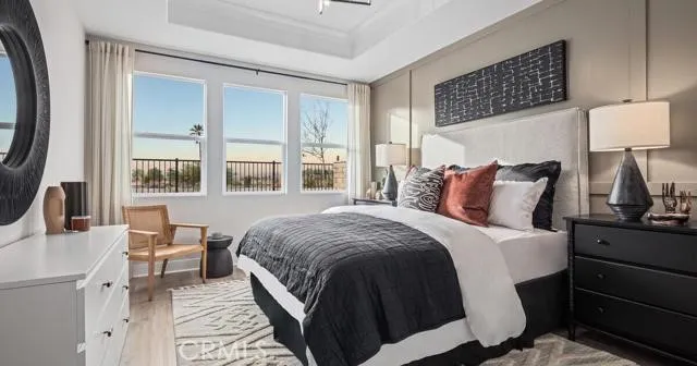 a bedroom with a bed lamps and window