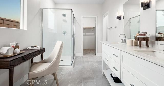 42409 Lamporo Way Indio, CA 92203 - Photo 19 of 24 a spacious bathroom with a granite countertop sink a mirror and a shower