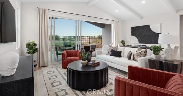 42409 Lamporo Way Indio, CA 92203 - Photo 2 of 24 a living room with furniture fireplace and a large window