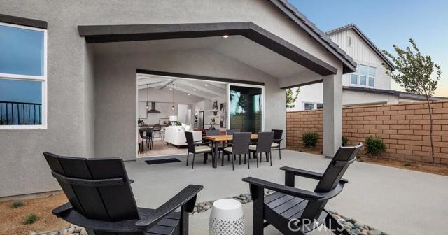 42409 Lamporo Way Indio, CA 92203 - Photo 23 of 24 a dining room with furniture and a potted plant