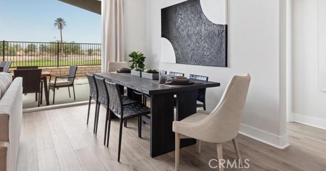 42409 Lamporo Way Indio, CA 92203 - Photo 6 of 24 a view of a dining room with furniture window and wooden floor