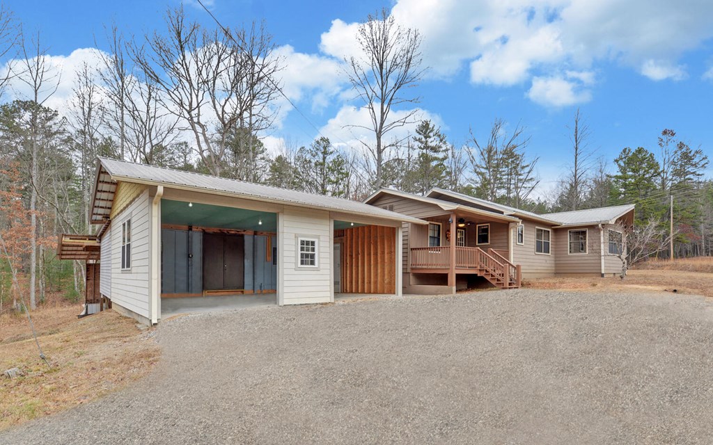 16 Bell Lane Morganton, GA 30560 - Photo 39 of 51 a house with trees in front of it